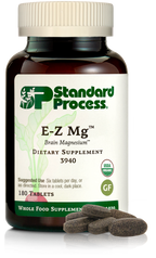 Image of E-Z Mg bottle next to tablets of magnesium supplements.